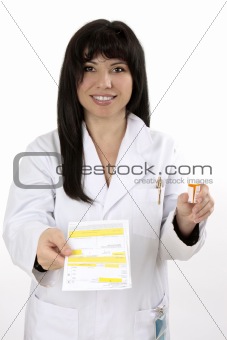 Pharmacist with prescription and medicine