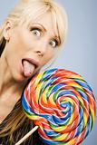 Woman licking a lollipop