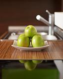 Green apples on kitchen table
