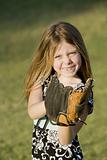 Cute young girl with a baseball