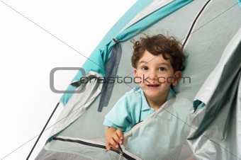 young boy in a tent