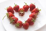 Wedding rings inside strawberry heart