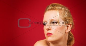 thoughtful blonde girl on red 