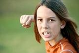 Boy with Long Hair Throws a Punch