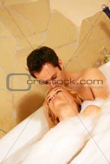 a couple is taking a bath