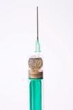 syringe with coins