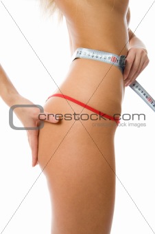 Young woman measuring waist with a tape stock photo (182967