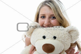 Happy little girl with teddy bear