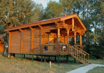 The wooden house with a porch.