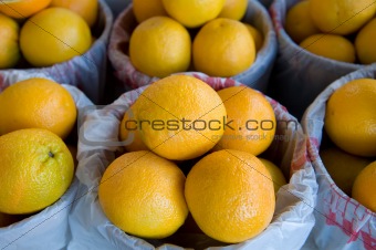Large oranges at a fresh marketplace