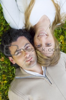 Young Couple Relaxing on a Lawn