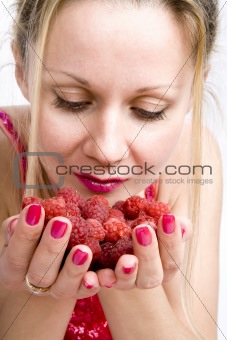 Blonde woman with raspberries