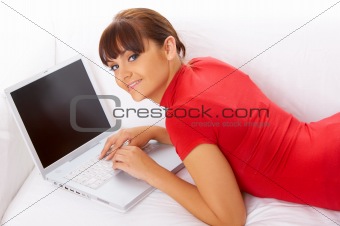 Girl with laptop on couch