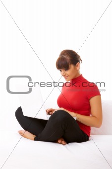 Girl with laptop on couch