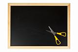 Chalkboard with yellow scissors