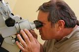 Doctor working with microscope