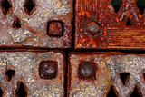 grunge rusty metal frames four corners with rivets close-up