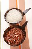 Himalayan Red Long grain and white Rice in coconut bowl on table