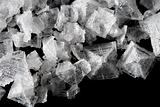 sea salt crystals flakes on black background
