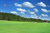 little house in grass field