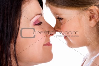 Mother and daughter touching noses