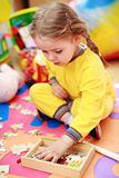 Cute child playing with puzzle