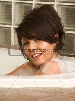Attractive young sexy female taking bath
