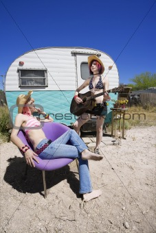 Young Women in Front of a Trailer