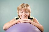 Woman Leaning on an Exercise Ball