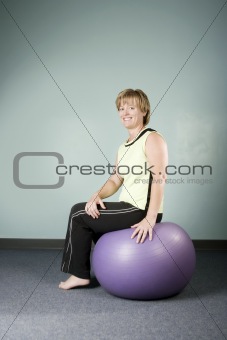 Woman Sitting on an Exercise Ball