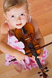 Little girl with a violin - top view
