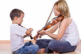 Boy and woman practicing the violin