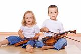 Little boy and girl with violins