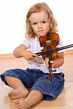 Little girl practicing the violin