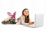 Little girl lying with laptop