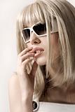 woman in blonde wig and sunglasses