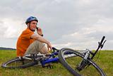 Man with mountain bike talking on cell phone